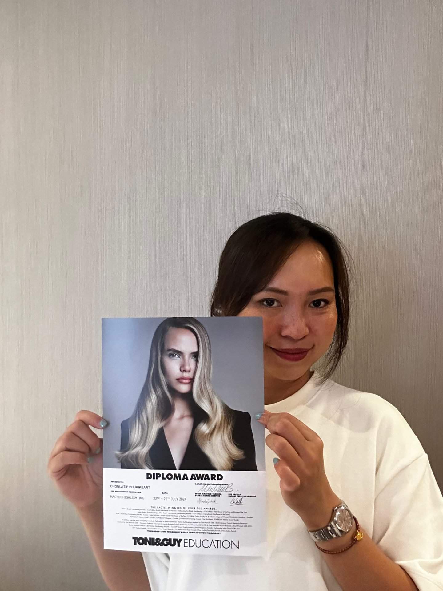 Chonlatip Phurikeart at Dalah Hair holding a Diploma Highlighting Masterclass from Toni&Guy